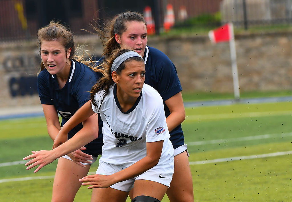 Columbia College defender Elisa Vega battles with Lyon College's Emma Brandes and Claire Coley